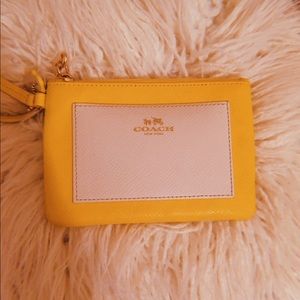 COACH yellow leather wristlet